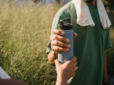 Close up of a sports towel and water bottle