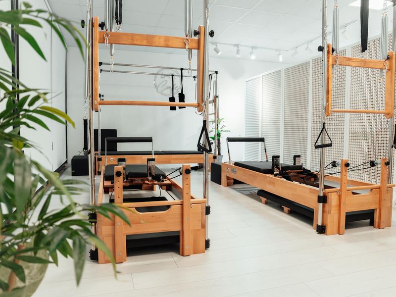 Interior of a minimalist fitness studio with wooden floors